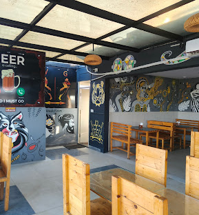 Bull House seating area with murals